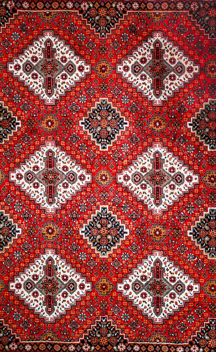 Detailed traditional oriental carpet pattern with vibrant colors and geometric motifs.